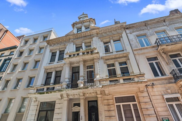 A historic building with classical architecture, multiple windows, and a prominent entrance.