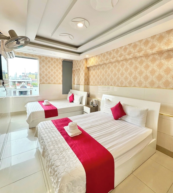 Family Room, 2 Queen Beds, Air conditioning, City View | Blackout curtains, soundproofing, iron/ironing board, free WiFi