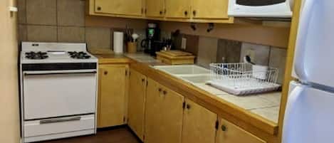 Fridge, oven, stovetop, dining tables