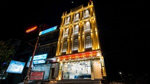 A hotel with a classic architectural style, featuring large arched windows and a prominent entrance. - Hotel Pearl Heritage (Jaipur)