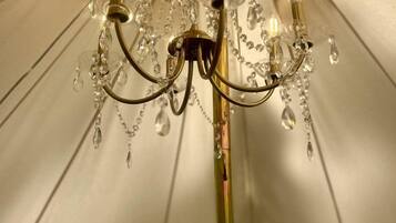 A chandelier with multiple light fixtures and crystal decorations.