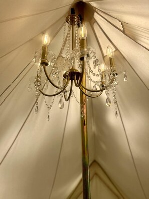 A chandelier with multiple light fixtures and crystal decorations.