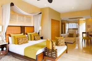 A spacious hotel room with a large bed, a sitting area, and a separate bathroom. - 5-Diamond Resort ◆ Garza Blanca PV 3BR ◆ Save 45% vs. Garza Blanca Direct (Puerto Vallarta)