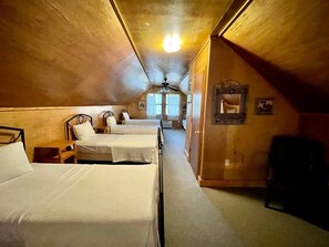 A room with three beds, wooden walls, a ceiling fan, and a window with curtains. - Spacious Luxury Cabin with Resort Amenities Near Zwolle, LA (Zwolle)