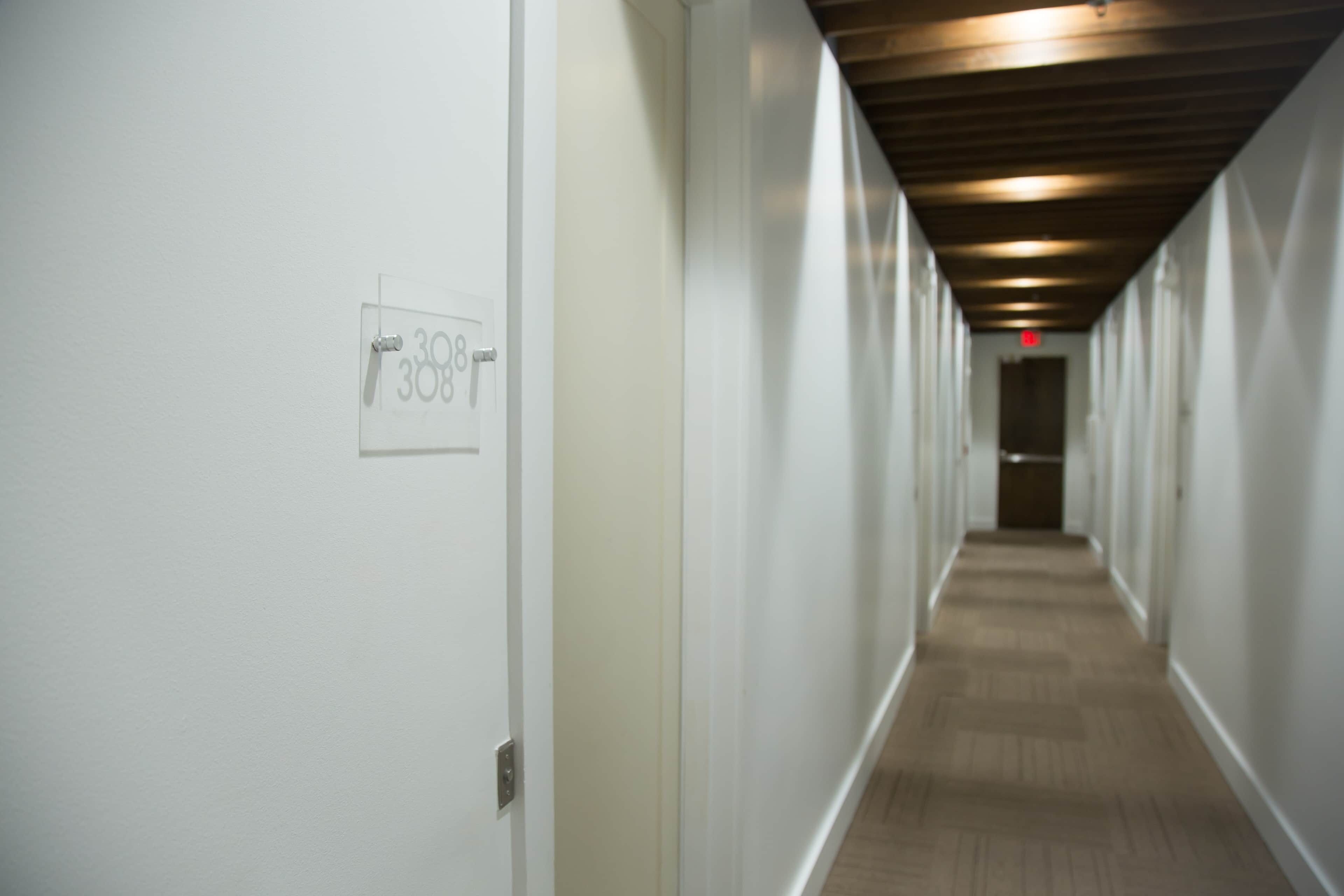 A hallway with a door labeled '308'.