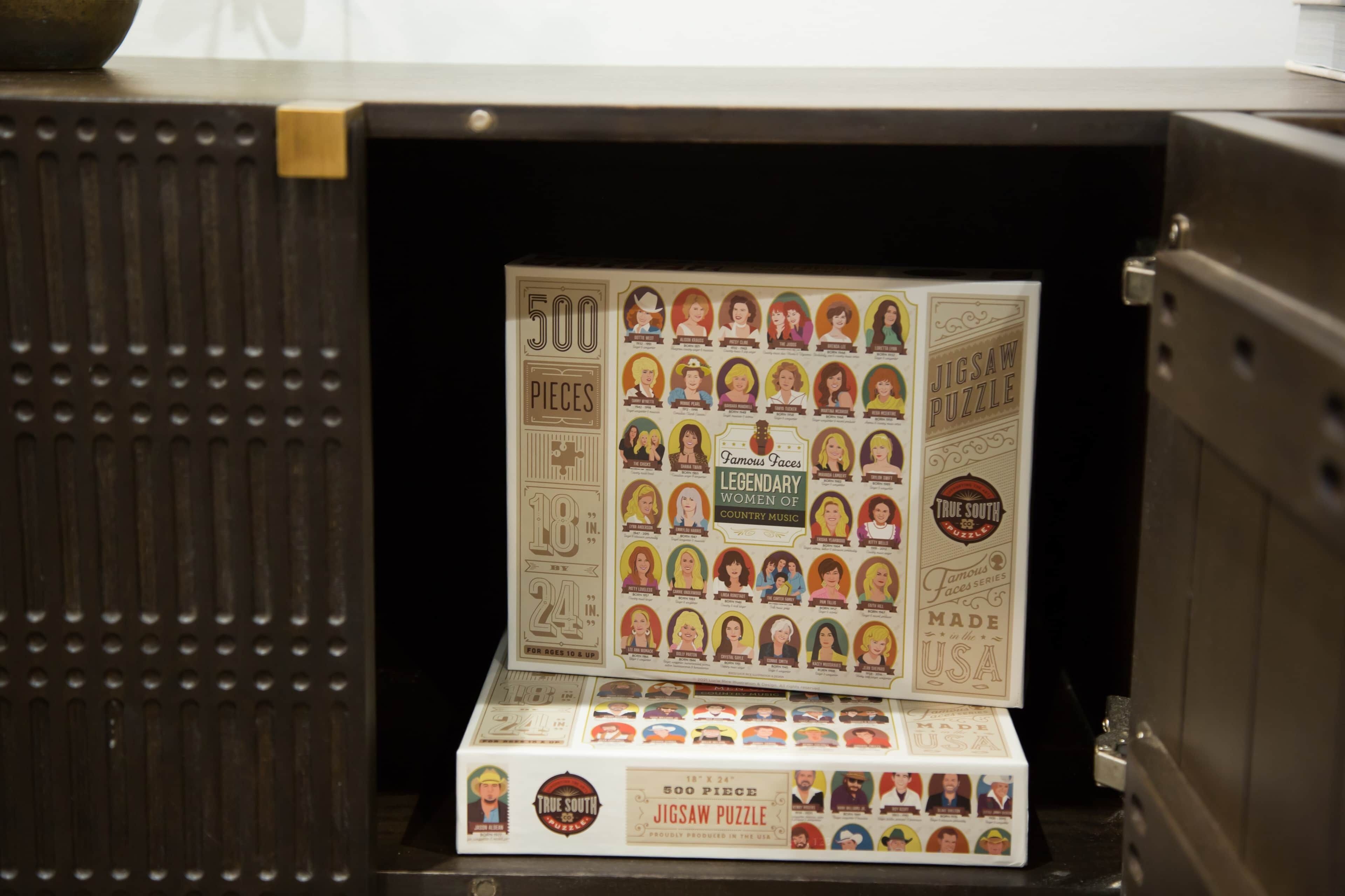 A jigsaw puzzle box with 500 pieces, labeled as 'Famous Faces Legendary Women of Country Music,' made in the USA.