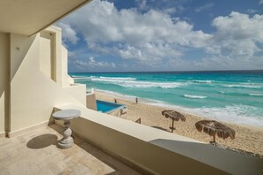 A balcony with a view of the beach and ocean. - Luxury Ocean View Villa - Hotel Zone Solymar Condo Villa 11 (Cancún)
