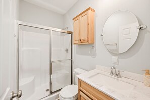 Shower, hair dryer, towels, shampoo