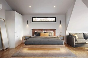 Ein modernes Schlafzimmer mit einem großen Bett, einem Sofa, einem Kleiderschrank und einem Fenster mit Blick.