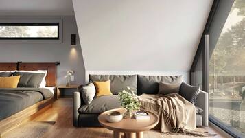 A modern bedroom with a bed, a sofa, a round table, and a large window.