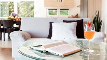 Villa (Three Bedroom Villa with Sea View) | Living room | 32-inch flat-screen TV with satellite channels