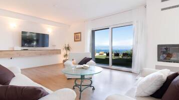 Villa (Three Bedroom Villa with Sea View) | Living room | 32-inch flat-screen TV with satellite channels