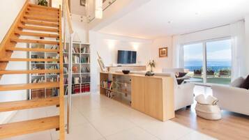Villa (Three Bedroom Villa with Sea View) | Living room | 32-inch flat-screen TV with satellite channels