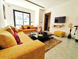 Apartamento, 1 quarto, sacada, vista para o jardim | Sala de estar