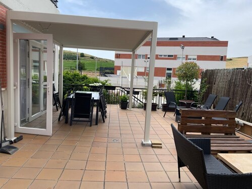 3-bedroom apartment with a 100-meter patio featuring a barbecue and an outdoor pool
