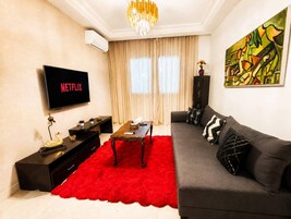 Apartamento, 2 quartos, sacada, vista para o jardim | Sala de estar