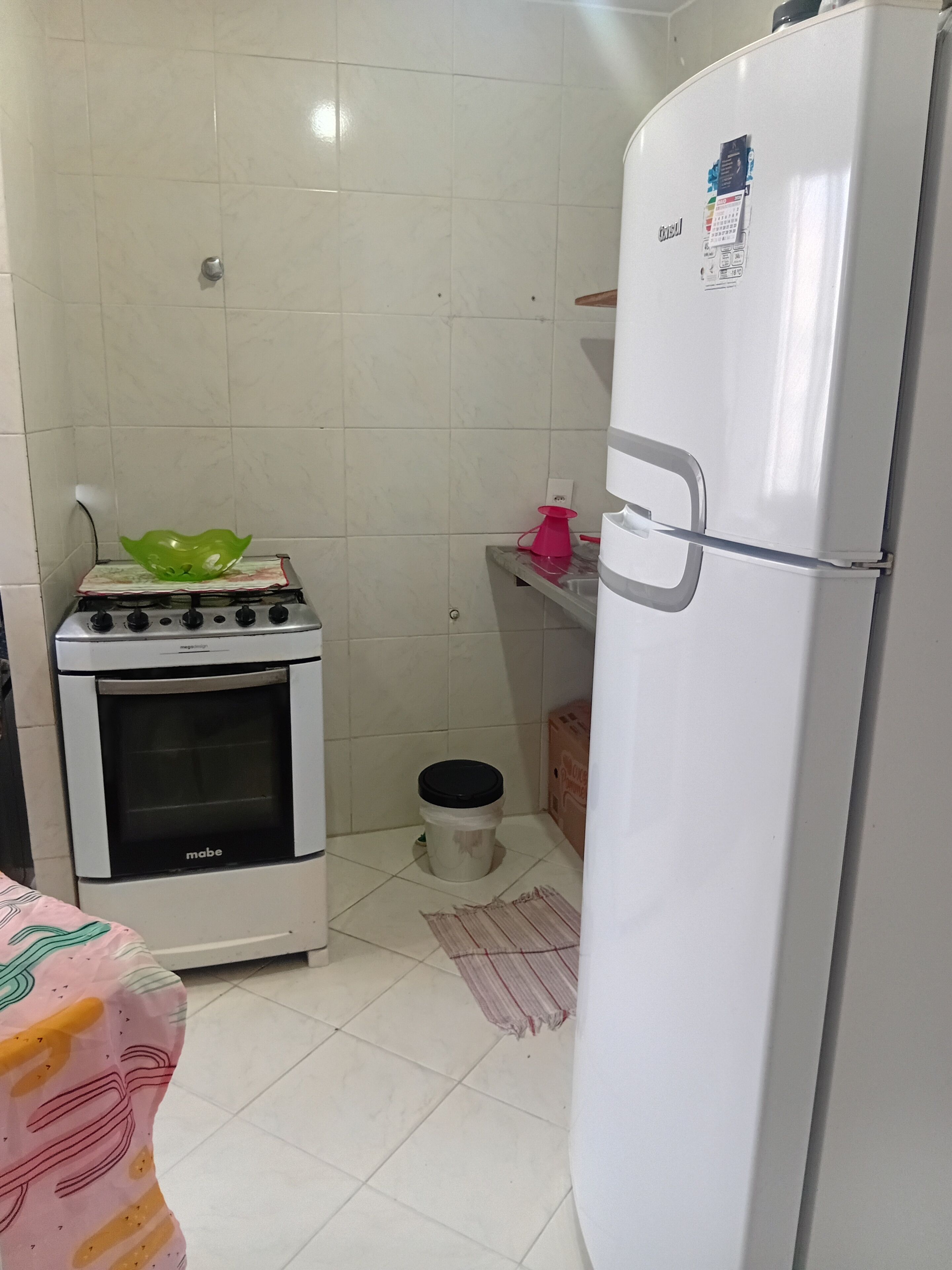 A kitchen with a stove, oven, and refrigerator.