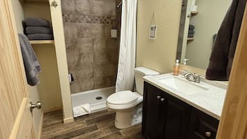 Shower, hair dryer, towels, soap