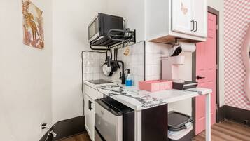 Microwave, stovetop, coffee/tea maker, cookware/dishes/utensils