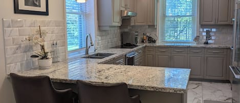 Coffee/tea maker, fridge, microwave, oven
