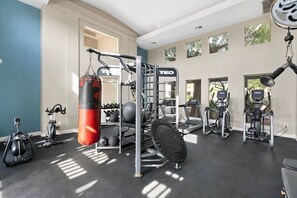 A gym with cardio machines, weightlifting equipment, and a punching bag. - WestWorld, Mayo Clinic & McDowell Mountain Ranch Nearby Golf, Pool, Spa & Hiking (Scottsdale)