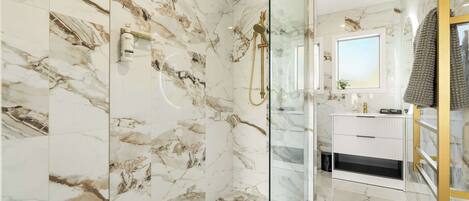 Shower, hair dryer, towels, shampoo