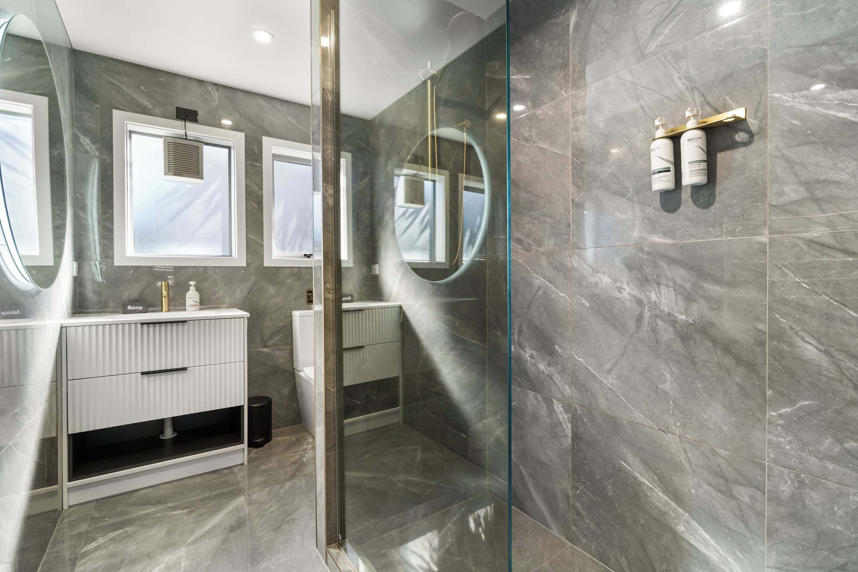 Shower, hair dryer, towels, shampoo