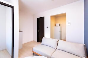 Habitación económica con 2 camas individuales | Zona de estar