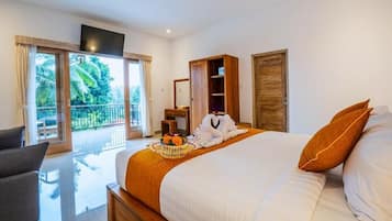 Deluxe Suite, Balcony, Garden View | In-room safe, blackout drapes, soundproofing, iron/ironing board