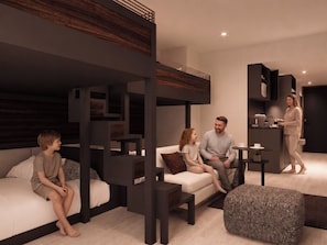 Ein modernes Wohnzimmer mit Sofa, Couchtisch und integrierter Küchenzeile.