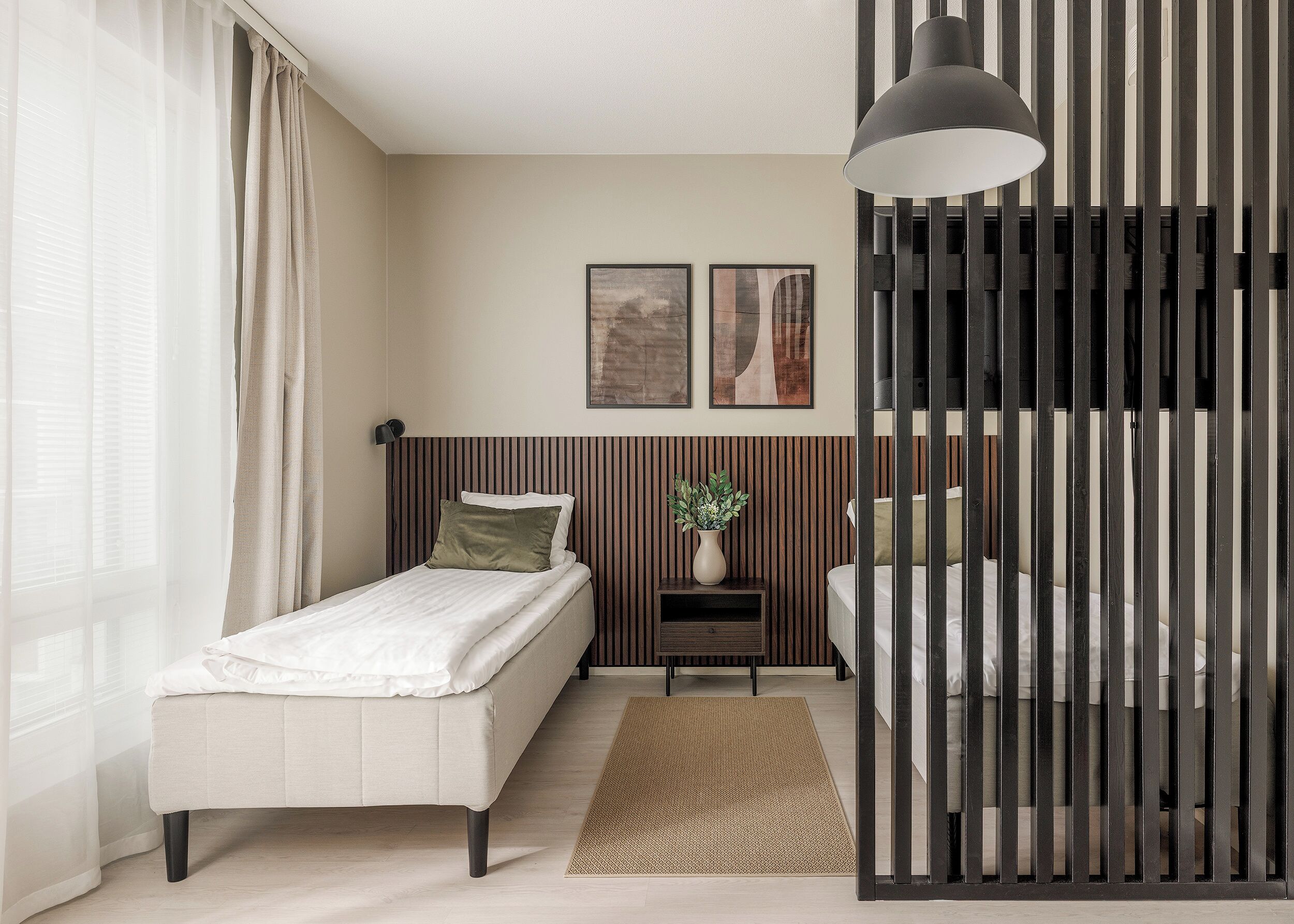 Bright modern twin bedroom with stylish divider and natural light