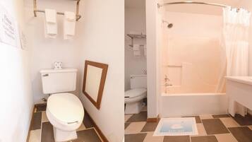 A bathroom with a toilet, a shower, and a bath mat.