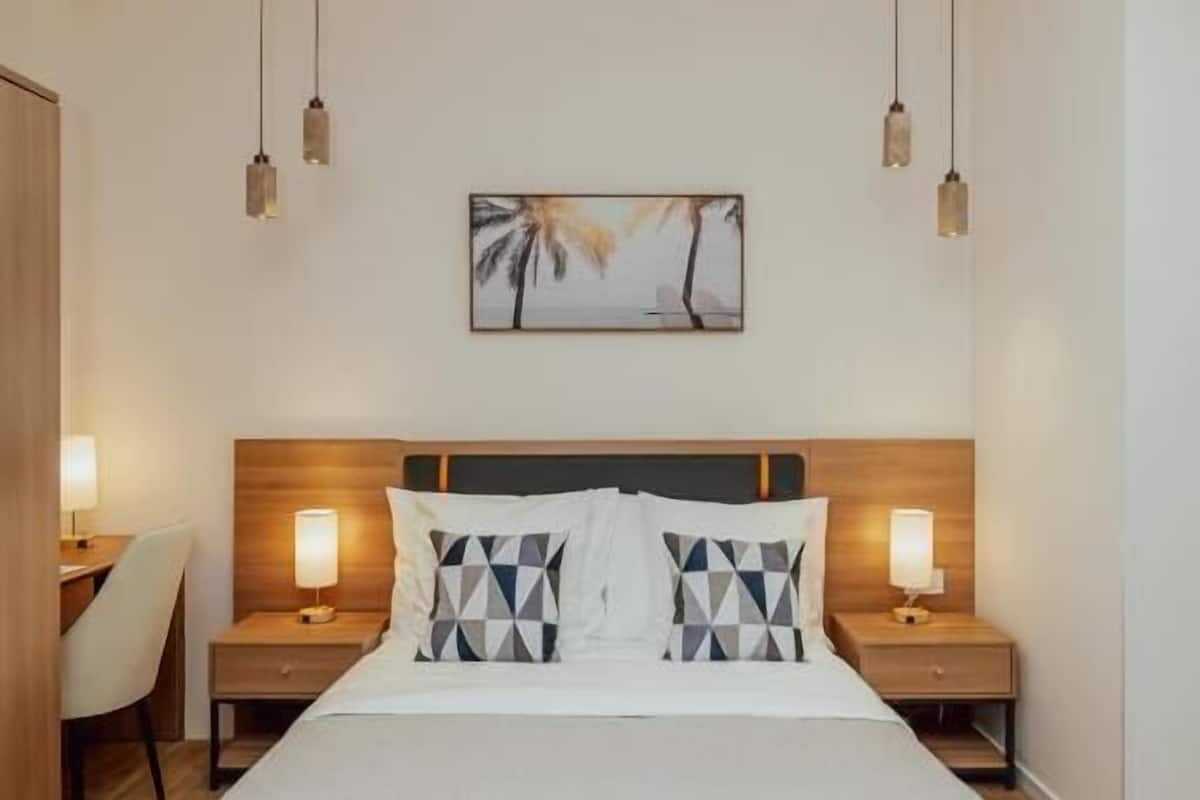Deluxe Double Room, Mountain View | In-room safe, desk, laptop workspace, blackout drapes