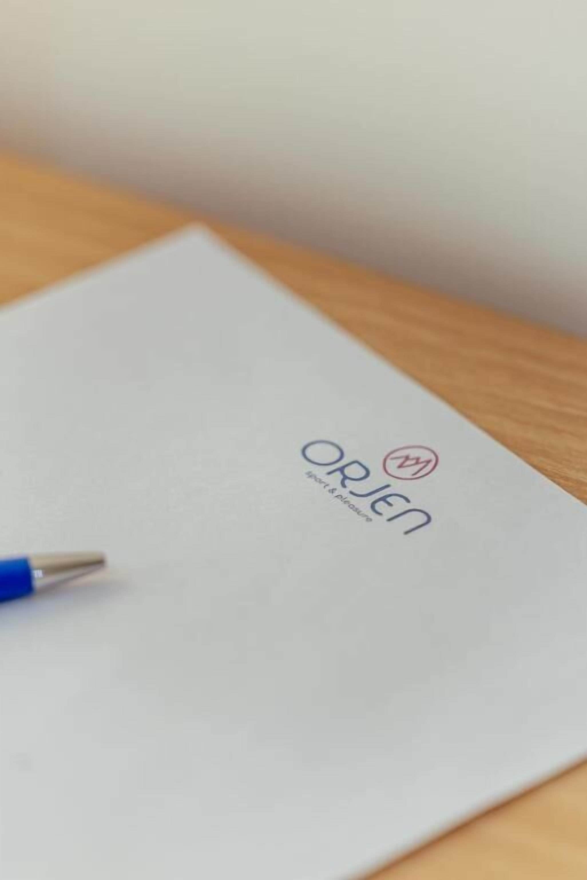 A white envelope with the logo 'ORJEN' and the text 'sport & passion' on it.
