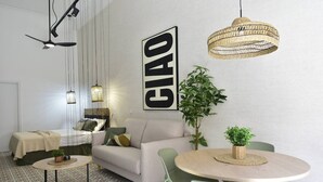 Ein modernes Wohnzimmer mit einer Couch, einem runden Tisch, Stühlen, einer Pendelleuchte und einem großen Wandzeichen.
