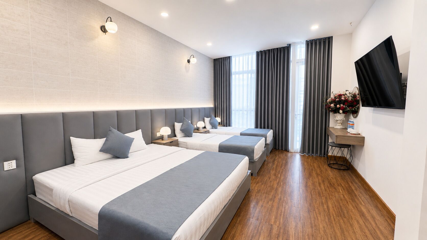 Deluxe Quadruple Room, City View | In-room safe, desk, blackout curtains, soundproofing