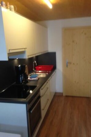 Fridge, oven, cookware/dishes/utensils - Ferienwohnungen Chasa Valär, (Scuol) by Interhome (Scuol)