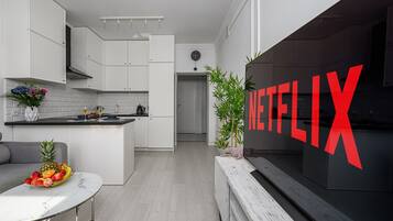 Lägenhet Superior - utsikt mot staden | Vardagsrum | 40-centimeters tv med digitalkanaler