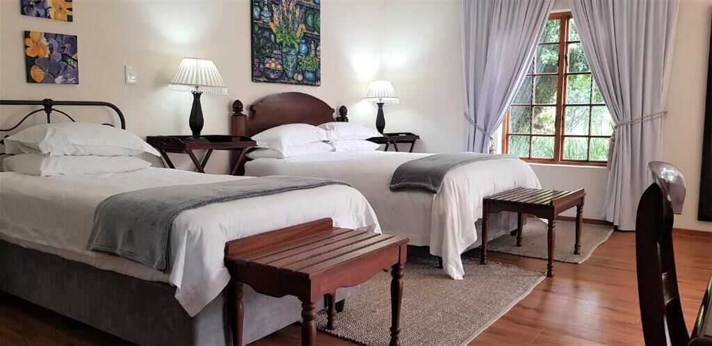 Habitació triple Deluxe, vistes al jardí | Escriptori, espai de treball apte per a portàtils i wifi gratuïta 