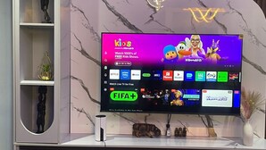 A television displaying a children's show interface with various streaming service logos. - The Address 127 - Refined Apartments (Abuja)