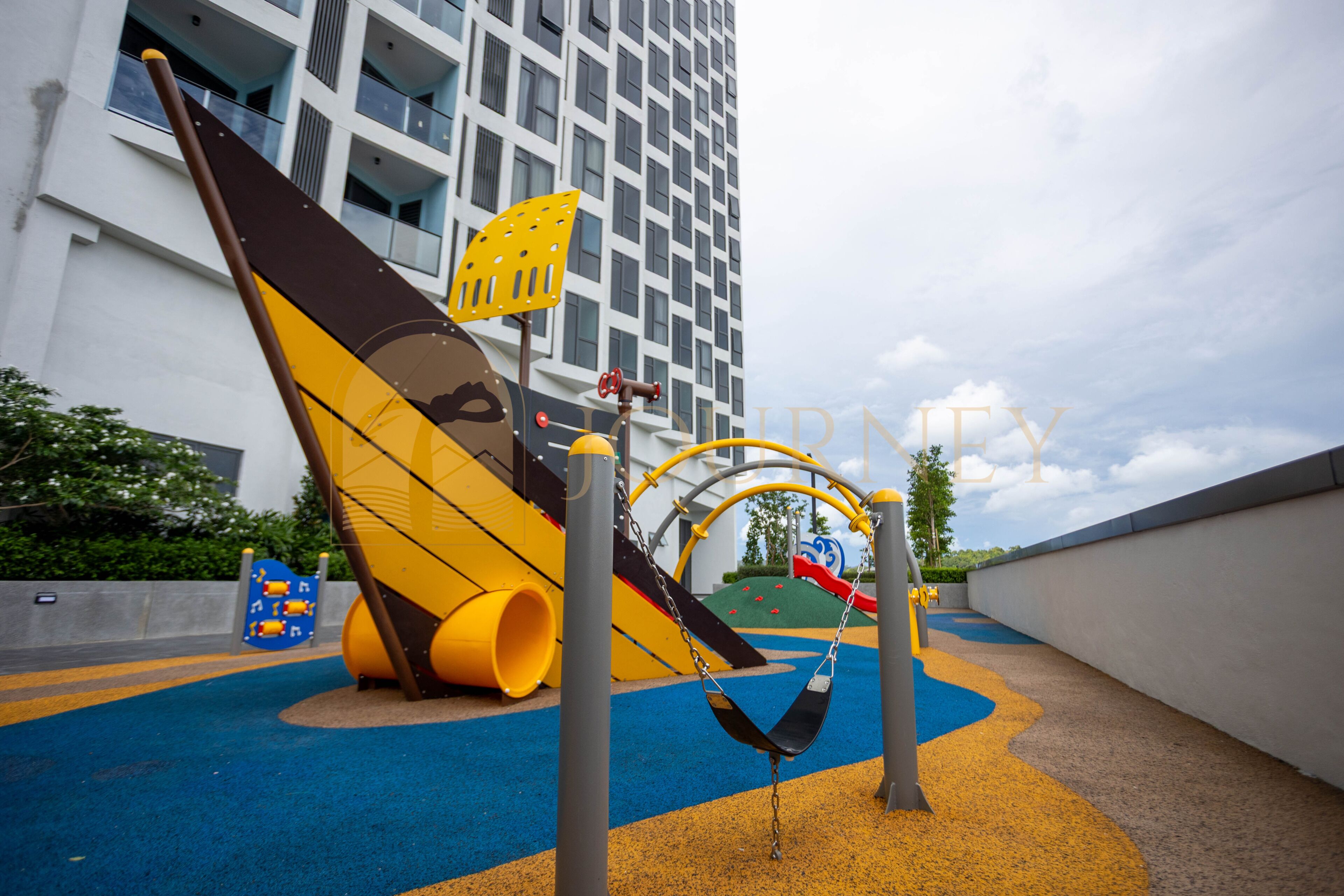 A playground with a slide, swings, and a climbing structure.