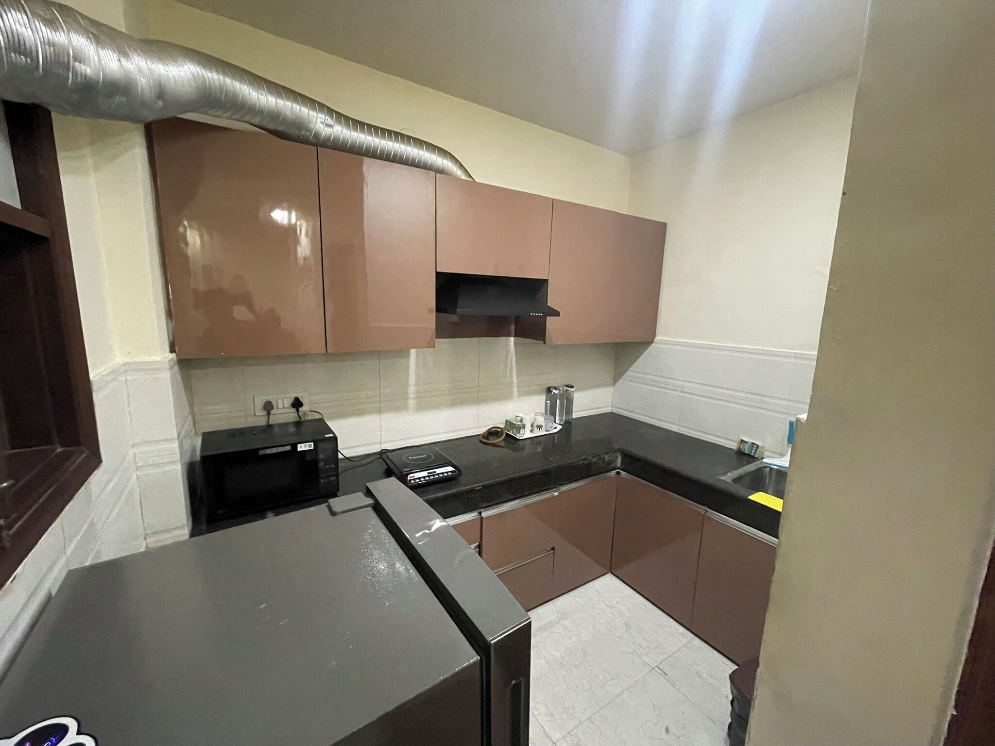 Fridge, microwave, electric kettle, cookware/dishes/utensils
