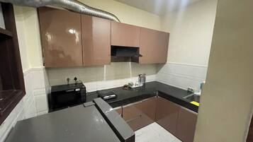 Fridge, microwave, electric kettle, cookware/dishes/utensils