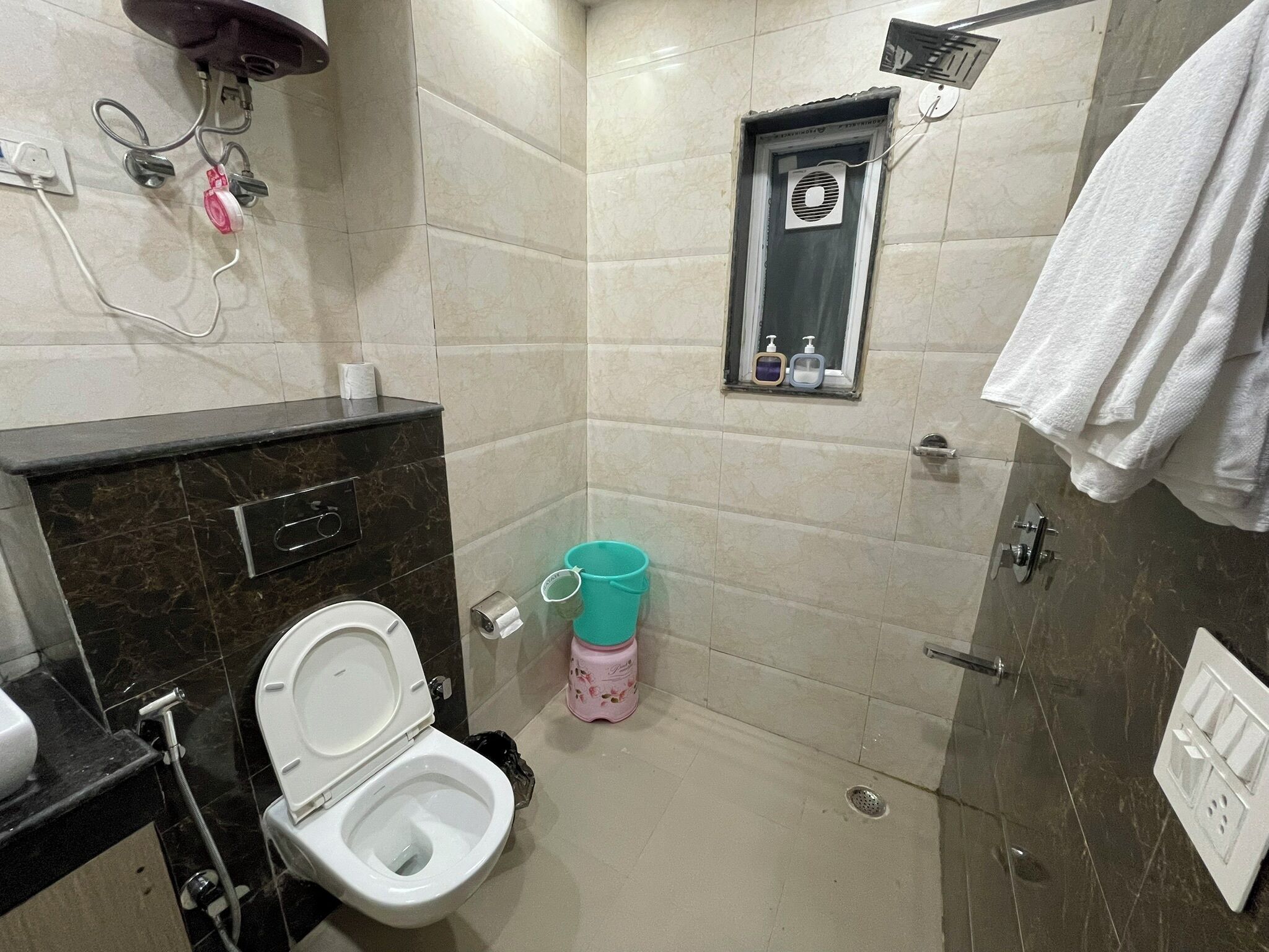 Bidet, towels, soap, toilet paper