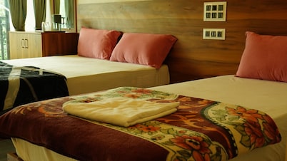 Vasu Inn - Rooms in Valparai