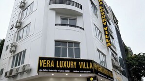 A multi-story building with a prominent sign for 'Vera Luxury Villa.' - Vera Luxury Hotel (Hanoi)