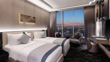 Deluxe Twin Room | In-room safe, desk, laptop workspace, iron/ironing board