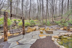 A stone pathway, wooden benches, a small pond, and a forested area. - Private Balcony! Mtn-view Sanctuary in Burnsville (Burnsville)