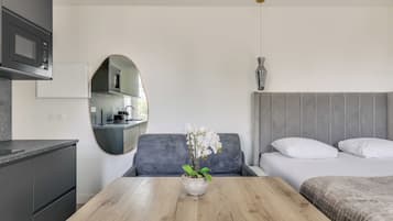 Apartment | Laptop workspace, iron/ironing board, bed sheets