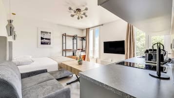 Apartment | Laptop workspace, iron/ironing board, bed sheets